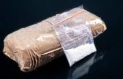 Cocaine powder in plastic bag with a packages