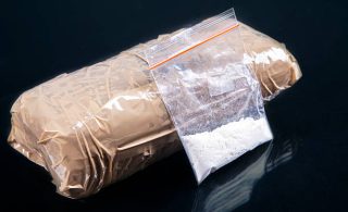 Cocaine powder in plastic bag with a packages